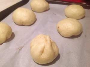 Pinch your Anpan dough together and then place it seam-side down on your baking sheet.